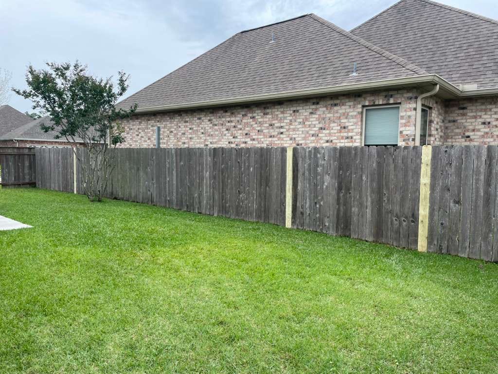 Fence repair with new posts and pickets