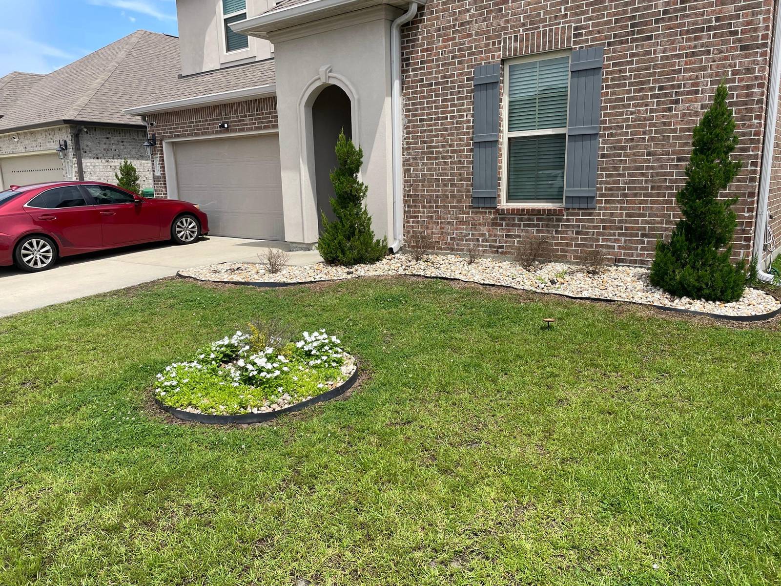 Mowed and edged front lawn by Binder's Landscapes