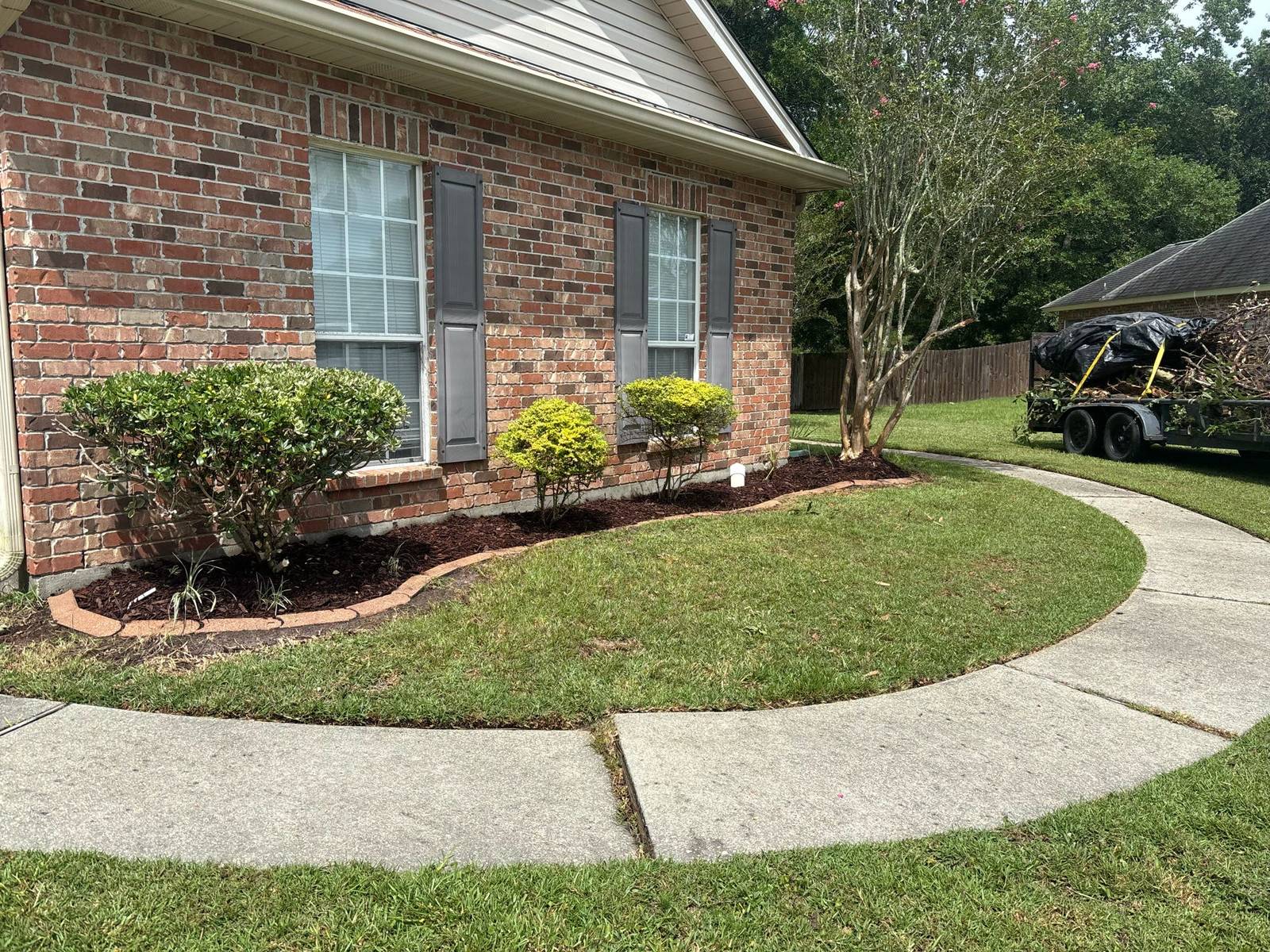 Mowed lawn with edged sidewalk by Binder's Landscapes