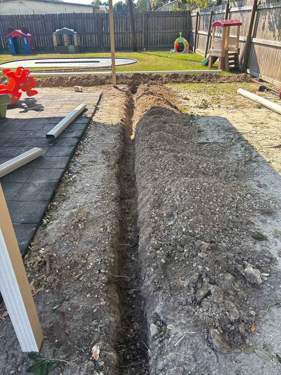 Backyard trench dug for a French drain